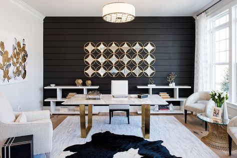 Curated gold accents throughout the home office give it a polished look White Gold Office, Neutral Paintings, Luxury Office Interior, Transitional Home Office, Gold Office Decor, Black Home Office, White Armchair, Gold Office, Look Office