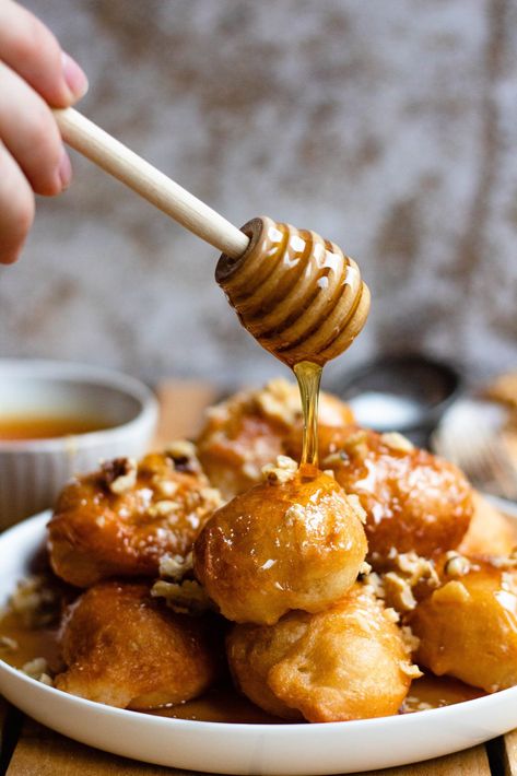 Loukoumades are a delightful dessert from Cyprus and Greece. They are fried donuts coated in honey and sprinkled with cinnamon and walnuts. Loukoumades Recipe, Cypriot Food, Fried Donuts, Greek Desserts, European Recipes, Easy Summer Meals, Global Recipes, European Food, Food For A Crowd