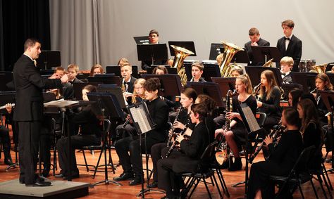 Associate Band Director Andrew Buttermore directs a song during the Ames High School band holiday concert Monday evening at the high school auditorium. Another school music concert this week is the joint Mitchell and Sawyer elementaries chorus concert at 6 p.m. on Thursday at Ames Middle School. Photo by Sarina Rhinehart/Ames Tribune High School Concert Band Aesthetic, Band Class Aesthetic, Band Director Aesthetic, High School Band Aesthetic, School Band Aesthetic, Band Aesthetic High School, Sophomore Year High School, Band High School, High School Auditorium