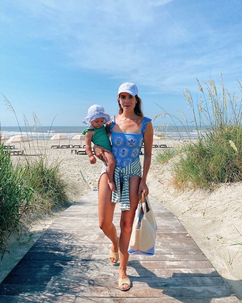 Gal Meets Glam Daily Look featuring Julia wearing Agua by Agua Bendita swimsuit, Olive shirt, Fabletics hat, Rue de Verneuil tote, and Carrie Forbes sandals. Olive Shirt, Julia Berolzheimer, Blue One Piece Swimsuit, Gal Meets Glam, Floral One Piece, Ruffle Swimsuit, Daily Look, Outfit Details, Simple Dresses