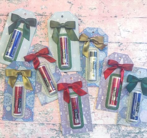 I have a quick and easy gift idea I wanted to share.  Each year at the holidays, I always give out hand sanitizer and lip balm along with my gifts as a little extra something.  I have bee… Lip Balm Christmas Gift Ideas, Lip Gloss Gift Ideas, Lip Balm Holders, Lipstick Gift Wrapping Ideas, Hand Sanitizer Gift, Easy Gift Idea, Chapstick Lip Balm, Holiday Lip, Lip Balm Holder