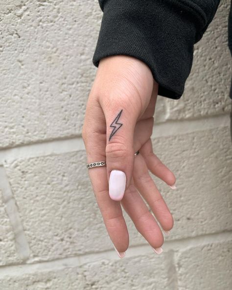 Lettering For Finger Tattoos, Left Handed Tattoo Ideas, Hand Tattoos Lightning Bolt, Lightening Bolt Hand Tattoo, Finger Tattoos Lightning Bolt, Finger Lightning Tattoo, Small Western Hand Tattoos For Women, Cute And Simple Tattoos For Women, Lighting Bolt Finger Tattoo