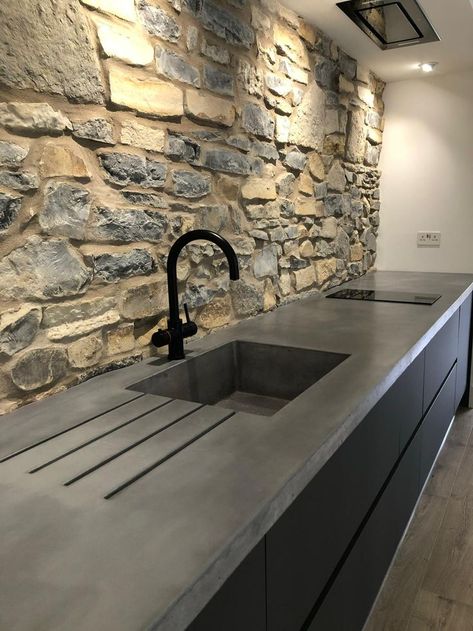 Our longest worktop to date, consisting of a large integral bespoke sink and drain grooves. The client wanted a worktop that seamlessly moulded and complimented the natural stone wall, so after some intricate templating and precise form work, the end result was a totally bespoke kitchen surface.

Finish: Smooth
Colour: Thunder

#bespoke #polished #concrete #polishedconcreteworktop #concretekitchen #polishedconcrete #kitcheninspo #bespokekitchen #kitchenisland #interiors #bespokefurniture Concrete Worktop Kitchen, Polished Concrete Worktop, Concrete Kitchen Sink, Polished Concrete Countertops, Polished Concrete Kitchen, Concrete Worktop, Stone Walls Interior, Concrete Countertops Outdoor, Kitchen Surface