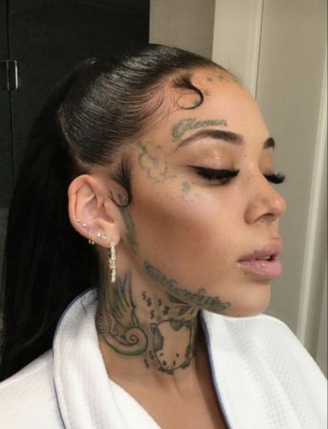 Over Eyebrow Tattoos For Women, Tattoo On Side Of Face By Ear, Small Face Tattoos For Women Above Eyebrow, Face Tattoo Above Eyebrow, Feather Face Tattoo, Over Eyebrow Tattoo, Loyalty Face Tattoo, Jaw Tattoo Face, Side Of The Face Tattoo