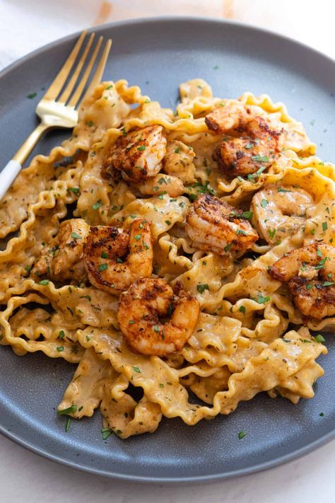 Spice up your dinner with this irresistible Cajun Shrimp Scampi! This Spicy Shrimp Scampi Recipe combines succulent shrimp with zesty Cajun seasoning for a flavor explosion. Perfectly paired with pasta, this dish offers a creamy, bold twist on classic scampi. Whether you're looking for a weeknight dinner or something to impress guests, this Easy Cajun Shrimp Scampi is sure to become a favorite. Get ready to enjoy a meal that's both delicious and exciting! Cajun Shrimp Scampi, Italian Fish Recipes, Italian Seafood Stew, Shrimp Scampi Pasta, Comfort Pasta, Italian Seafood Recipes, Cajun Shrimp Pasta, Homemade Cajun Seasoning, Creamy Pasta Recipes