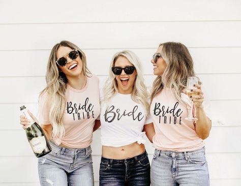 Bride Tribe Bridesmaid Tees by Knot and Hitch - The perfect matching shirts for bridesmaids including tees and tanks! A list of our favorite tee shirt designs for bridesmaids including brides babe tanks, bride tribe tees and I do crew shirts. Bridesmaid tanks and tees from Etsy and curated by expert wedding accessory designer The Garter Girl. #gartergirl #thegartergirl #gartergirlloves #etsy #shopetsy #bridesmaidshirts #bridesmaidtees #bridesmaidtanks Bride Tribe Shirts, White Bachelorette, Bride Tribe Shirt, Veuve Cliquot, Bachelorette Tees, Pink Bachelorette, Matching Bridesmaids, Bachelorette Party Outfit, Bride Bachelorette