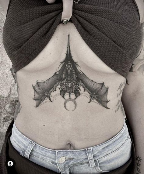 Upside Down Bat Tattoo Sternum, Bat Tattoo Under Breast, Bat Tattoo Stomach, Bat Underbust Tattoo, Bat Wings Back Tattoo, Goth Chest Tattoo Female, Bat Chest Tattoo Female, Spooky Sternum Tattoo, Sternum Bat Tattoo