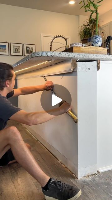 Kelly Lopez on Instagram: "I wish these wood panels were cheaper 😂🪚🪵

#diyprojects #woodpaneling #woodwall #accentwall #kitchenisland #diyideas" Kitchen Island Dowel, Wood Slats Island Kitchen, Wood Panel On Kitchen Island, Wood Paneling On Kitchen Island, Tile Kitchen Island Base, Wood Panel Kitchen Island, Pole Wrap Kitchen Island, Kitchen Island Side Panels, Kitchen Gate Design