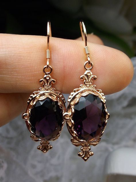 "Simulated Purple Amethyst Earrings Pin Design#E18 Custom Made These are Victorian reproduction estate earrings in rose gold plated sterling silver with flawless simulated purple amethyst gemstones. Each stunning 6ct gem is 14mm long (9/16th\") and 10mm in width (3/8th\"). The earrings are 1 3/4th inches long. Notice the beautiful fleur de lis on the bottom and top of the setting. These lovely earrings were fashioned from an antique Victorian floral brooch. A gift box is included and all items a