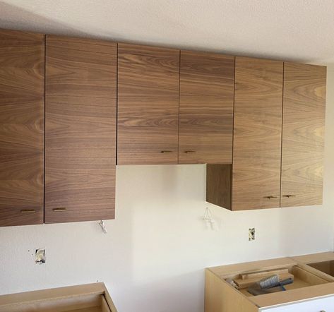 On the job! We’re currently installing these beautiful Earthwoods Custom Cabinets in a two-toned kitchen remodel. Uppers will be this beautiful Walnut Veneer and the base cabinets will be Textured Melamine White. Do you prefer two tone kitchens? Comment below! #questionoftheday #veneer #kitchendesign #moderndesign #moderninterior #interioroftheday #picoftheday #localbiz #denver #walnut #cabniets #refresh #custom Modern Wooden Kitchen, Two Tone Kitchen, Modern Kitchen Cabinets, Wooden Kitchen, Base Cabinets, Walnut Veneer, Custom Cabinets, Kitchen Cabinet, Modern Interior