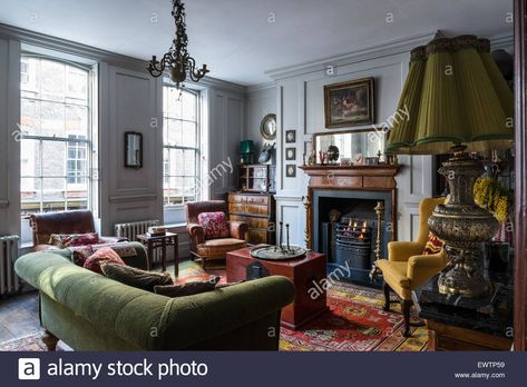 Green Couch Red Rug Living Room, Green Sofa Red Rug, Red Rug Green Couch, Green Couch Red Rug, Chest In Living Room, Red Sofa Living Room, English Townhouse, Green Sofa Living Room, Red Armchair