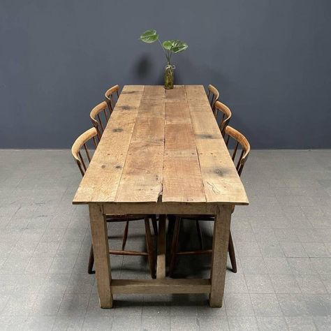 Beautiful rustic oak farmhouse kitchen table from France, around the 1930s. Beautifully made of oak beams and floorboards. The top is mounted to the base with brass and iron flat-head screws. We have cleaned this table, restored it where necessary and kept it as natural as possible. The light rustic oak wood gives a real wabi sabi feeling and the oak planks and beams feel smooth and soft. The legroom between the floor and the bottom edge of the table has a height of 62 cm. A beautiful specimen f Farmouse Kitchen Table, Light Brown Farmhouse Table, Chunky Kitchen Table, Homemade Wood Tables Dining Rooms, Picnic Kitchen Table, 30 Inch Wide Dining Table, Farm Dinner Table, Narrow Dinner Table, Rustic Kitchen Table Farmhouse Style