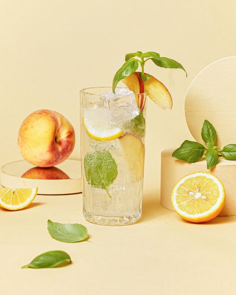 Lavender Lemonade Aesthetic, Lemonade Product Photography, Basil Lemonade Recipe, Lemonade Photography, Sparkling Water Recipes, Peach Basil, Summer Drink Recipe, Flavoured Vodka, Sliced Peaches