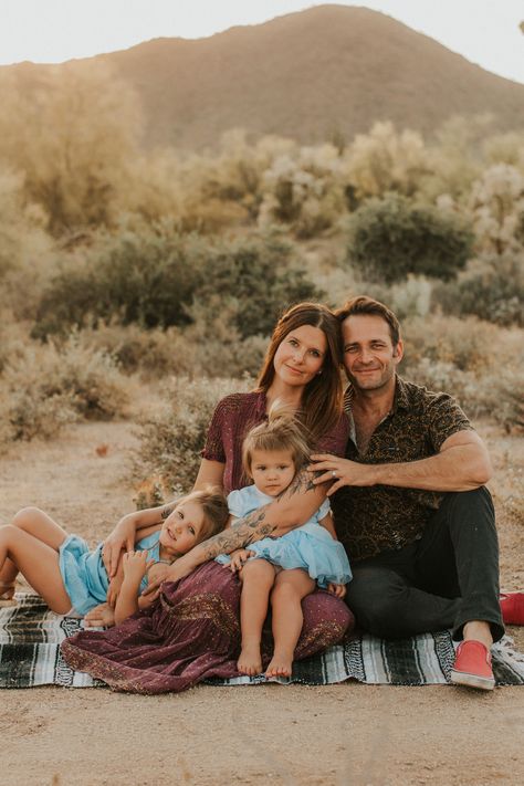 Desert family photos Desert Family Portraits, Family Pictures Sitting On Blanket, Family Photos In The Desert, Desert Photoshoot Ideas Family, Desert Christmas Photo Shoot, Desert Family Photos Outfits, Family Desert Photoshoot, Desert Family Pictures, Family Photos Desert