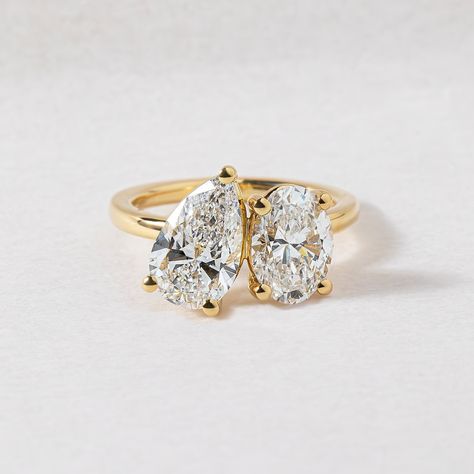 5 unique style trends our clients are choosing to make their rings stand out a little extra✨ 1. UNIQUE SIDE STONES & CUTS Unique cuts such as trapezoid, half-moon, trillian, and baguette cuts can complement and enhance the centre stone and brings more sparkle and dimension. Featured 1.50ct Hexagon cut with Kite sides stones | Bespoke 2. EAST WEST SET ELONGATED STONES Setting elongated stones like emerald, marquise, or oval cuts horizontally (east-west) across the band rather than the trad... Double Stone Engagement Ring, Bride Birthday, Two Stone Ring, Oval Moissanite Ring, Pear Cut Ring, Gold Anniversary Rings, Ring Proposal, Oval Diamond Ring, Stone Wedding