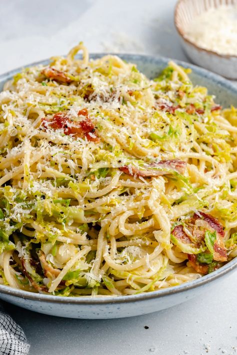 Incredible bacon parmesan brussels sprouts spaghetti packed with flavor and made with super simple ingredients. This easy brussels sprouts spaghetti recipe comes together in just 30 minutes for a delicious, protein-packed dinner the whole family will love! #brusselssprouts #spaghetti #pasta #healthydinner Brussel Sprout Pasta, Turkey Pesto Meatballs, Parmesan Brussels Sprouts, Bacon Brussel Sprouts, Shredded Brussel Sprouts, Ambitious Kitchen, Spaghetti Recipe, Sprouts With Bacon, Yummy Pasta Recipes