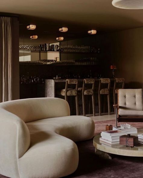 Waldo Fernandez on Instagram: "Bar sitting area with Pierre Augustin Rose sofa, Vincenzo De Cotiis coffee table, Prouvé visiteur chair. #waldosdesigns 📸: @billaltaright" Bar Sitting Area, Waldo Fernandez, Rose Sofa, Clements Design, Vincenzo De Cotiis, Central Table, Sofa Dining Table, Bar Interior, Home Bar Decor