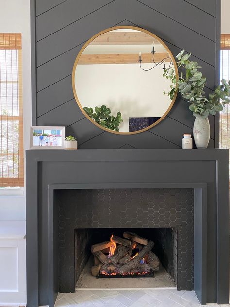 NEAT method- Simplified decor, dark mantle, mantle decor, family room, fireplace gray, brass mirror, round mirror, painted mantle, home design, modern design, digital frame, organization Framed Out Fireplace, Gold Accent Fireplace, Hanging Lights Above Fireplace, Charcoal Mantle, Dark Grey Mantle, Mantle Paint Colors, Dark Gray Painted Fireplace, Dark Gray Mantle, Slate Gray Fireplace