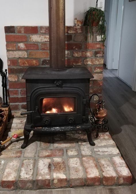 Raised Hearth Wood Stove, Stone Wood Stove Surround, Brick Hearth Wood Stove, Wood Burning Stove Hearth, Brick Pellet Stove Hearth, Wood Stove With Curved Pipe, Free Standing Wood Stove, Corner Fireplace Mantels, Free Standing Corner Wood Stove Harth