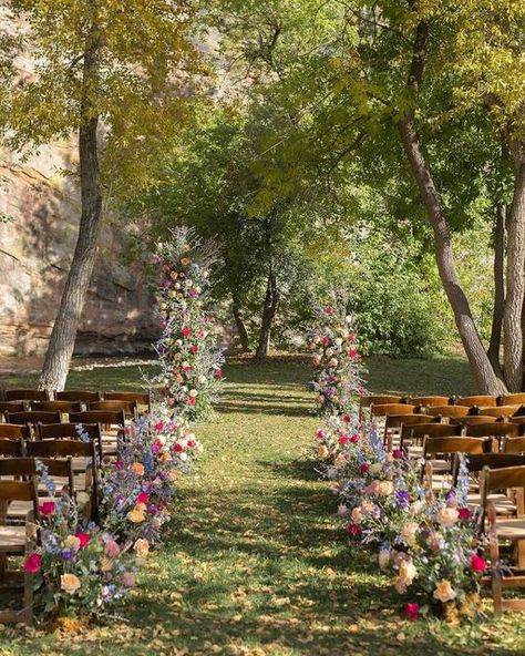 Colorado Wedding Florist on Instagram: "A+D’s whimsical September wedding was one of our favorites from the 2023 season! It was bursting with color and so many locally grown blooms! 💜🌸 : : #septemberbride #planetbluegrasswedding #ceremonyflowers #aislemeadows #floatingarch #floraltowers #whimsicalweddingflowers #whimsicalfloraldesign #coloradoweddingflorist #coloradogrownflowers #dreamceremony #septemberweddingflowers #aisleflowers #cosmosdaisies #dahlialove #colorfulweddingflowers #vibrantweddingflowers #floralbaddies #intothewoodswego #fallweddingceremony" Whimsical Wedding Fall, Whimsical Country Wedding, Flowers For Aisle Wedding, Wedding Venues Flowers, Wild Flower Wedding Decorations, October Wildflower Wedding, Wedding Ideas Wildflowers, September Garden Wedding, Autumn Wildflower Wedding