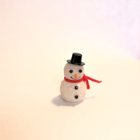 "Add this darling little flocked snowman to your Christmas village or to any miniature winter scene. Your dollhouse also has a place for this snowman during the holidays. I've added glitter to the snowman. It does not flake off.  You can choose a snowman with or without glitter. Please use the dropdown menu below.  1 1/2\" tall x 7/8\" diameter  PLEASE NOTE: due to variations in computer screen resolutions, the colors as you view them at home may vary slightly from the finished product you recei Christmas Miniatures Scene, Miniature Snowman, Dollhouse Christmas, Christmas Village, Winter Scenes, Flocking, Winter Decor, Winter Wonderland, Fairy Garden