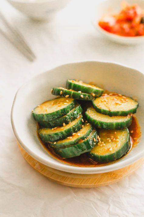 Sliced cucumbers in chili oil in a white bowl. Korean Pickles, Spicy Korean Cucumber, Korean Cucumber Salad, Korean Cucumber, Spicy Cucumber Salad, Bulgogi Beef, Spicy Korean, Spicy Pork, White Bowl