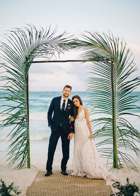 Palm fronds surround a beach wedding ceremony arch Beach Wedding Ceremony Arch, Collab Ideas, Beach Wedding Arch, Wedding Photography Props, Weddings Beach, Boda Ideas, Cape Wedding, Tulum Wedding, Wedding Ceremony Arch