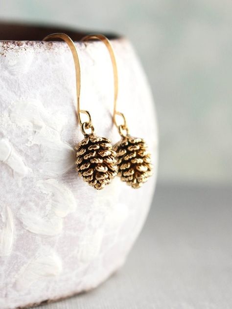 These are rustic nature inspired antiqued gold pine cone earrings! These little drop earrings have beautiful details highlighted by the antiqued gold over brass finish! These earrings are nickel free and lightweight, making them great for everyday wear.

These earrings measure approximately 1.2"(26mm) long and the pine cone charm is approximately .5" (12mm). Pine Cone Earrings, Pinecone Earrings, Horn Pendant Necklace, Small Drop Earrings, Handmade Holiday Gifts, Earrings Nature, Moon Pendant Necklace, Swarovski Necklace, Bird Earrings