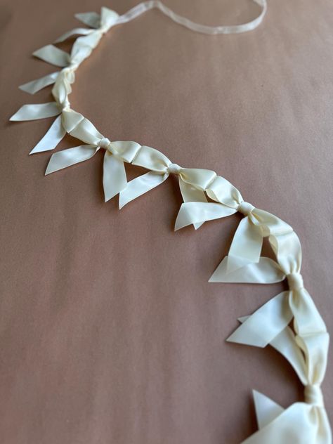 This dainty bow garland is perfect for decoration for any occasion. Use it for bridal parties, bachelorette weekends, baby showers, teen birthday parties, or even to decorate a little girl's room. Each bow is 3.5" wide and is tied off with ribbon on each end for convenient hanging.  Please select your desired length and color when ordering. Further customization available upon request! Just send me a message when ordering and we'll create something beautiful. Returns may be limited for customize Room Decor Garland, Bridal Shower Wall, Last Chapter Bachelorette, Bridesmaid Gift To Bride, Engagement Party Decorations At Home, Classy Party Decor, White Bridal Shower Decor, Beige Bachelorette Party, Simple Bachelorette Decor