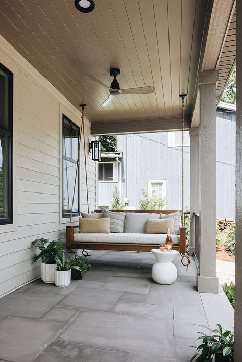 This lake house front porch is completed with a wood plank ceiling, ceiling fan and quintessential porch swing.   Design by Two Hands Interiors. View more of this lake house on our website.  #lakehouse #porch Lake House Front Porch, House With Front Porch, Lake House Porch, Wood Plank Ceiling, Plank Ceiling, House Porch, House Front Porch, Swing Design, House With Porch