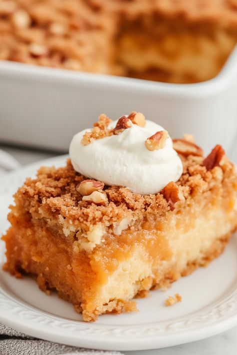 Indulge in the ultimate fall dessert with Pumpkin Pie Dump Cake! This easy-to-make recipe combines the warm flavors of pumpkin pie with the simplicity of a dump cake. Perfect for holiday gatherings or cozy nights at home, this delicious dessert will have everyone coming back for seconds. With layers of pumpkin puree, spice cake mix, and buttery pecans, each bite is a heavenly combination of sweet and spicy flavors. Pumkin Dump Cake, Dessert With Pumpkin, Pumpkin Spice Dump Cake, Pumpkin Pie Dump Cake, Spice Dump Cake, Spiced Pumpkin Pie, Pumpkin Pie Ice Cream, Dump Cake Recipe, Easy Pumpkin Pie