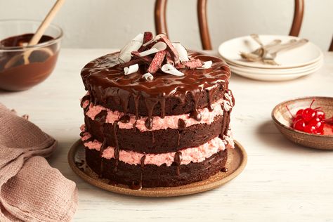 This Cherry Ripe layer cake recipe will delight your guests. Taking inspiration from the classic chocolate bar, this decadent cake has layers of chocolate sponge with cherry and coconut filling. It's sure to be a show stopper at your next event. Cherry Ripe Recipes, Cafe Food Ideas, Chocolate Ganache Icing, Most Popular Dessert Recipes, Australian Desserts, Cherry Cake Recipe, New Desserts, Ultimate Chocolate Cake, Popular Desserts Recipes