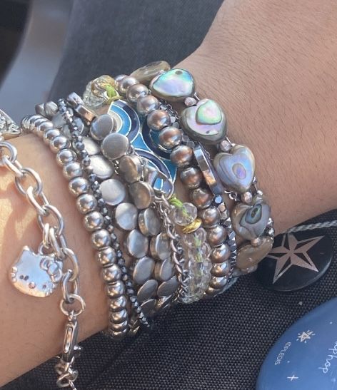 Outfit Inspo Jewerly, Lots Of Bracelets On Wrist Aesthetic, Lots Of Silver Jewelry Aesthetic, Silver Jewellery Layering, Silver Jewelry Stacking, Stacked Jewelry Necklaces Silver, Chunky Bracelets Aesthetic, Vintage Bracelet Stack, Y2k Bracelets Aesthetic