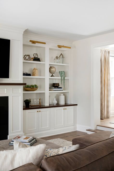 Custom white builtin book shelves, open storage, walnut wood top and paneled white fireplace surround. Style Built In Shelves, How To Style Built In Shelves, Shelves In Living Room, Diy Trinkets, Built In Shelves Living Room, Shelf Decor Living Room, Living Room Built Ins, Shelves Living Room, Cozy Living Room Ideas