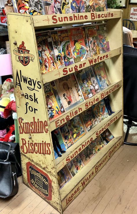 A wonderful metal grocery shelf for “Sunshine Biscuits” products. Covered in fantastic lettering! Probably from the 1940’s. Currently being used as a comic book stand in a thrift shop. Zine Storage, 80’s Room, Sunshine Biscuits, Comic Display, Comic Book Room, Comic Room, Comic Book Storage, Geek Room, Dolls House Shop