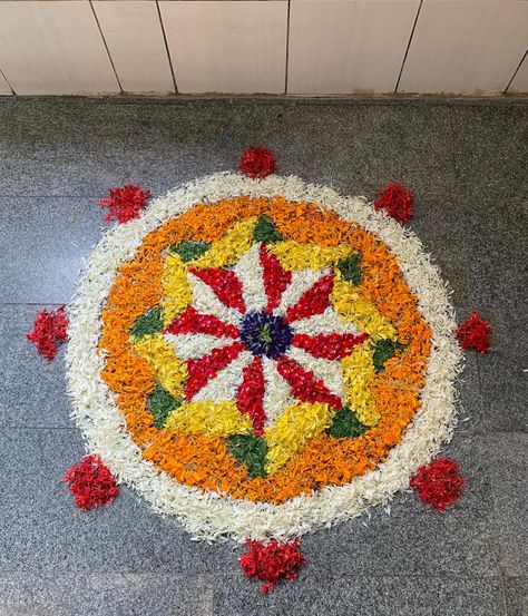 Onam pookolam Pookolam Design, Onam Pookalam Design, Flower Rangoli Designs, Onam Pookalam, Pookalam Design, Rangoli Designs Diwali, Flower Rangoli, Everyday Earrings, Rangoli Designs