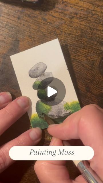 Erica Schaffel on Instagram: "Tips for painting moss in watercolor👇🏻  Part two of painting mossy rocks, in detail! If you missed the first part, I posted a separate reel yesterday with details on how I paint the rocks 😊.  Traditionally, with watercolors, you want to work light to dark. But I didn’t go to art school so I tend to just find what works for me through trial and error. With moss, I tend to go back and forth between dark and light. I have no reason for this at all… it’s just what works for me 🤷🏻‍♀️.  And if you want to paint moss this way, here are my top 2 tips 👇🏻  ✨Use a bright, opaque yellow paint. I use Sennelier Lemon Yellow.  ✨ Find yourself a good stippling brush! If you have any old, stiff brushes (generally used for oil painting) cut them up and these work great! How To Draw Moss On Rocks, How To Paint Moss Watercolor, Watercolor Moss Tutorial, How To Paint Moss, Watercolor Moss, Moss Painting, 2024 Tips, Moss Paint, Mossy Rocks