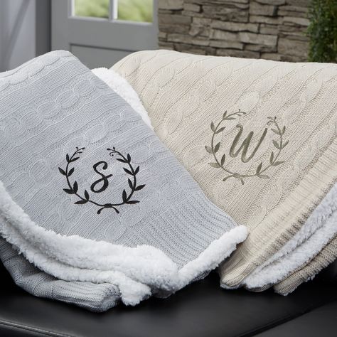 "Our Floral Wreath Personalized Throw Blanket has an incredibly, soft knitted sweater pattern on the front and an added bonus of sherpa on the reverse side. Medium weight that's not too heavy or too light makes it a cozy addition to your couch or sofa on a chilly evening.  - Embroidered with any name and choice of thread color - Cable knit front and sherpa on the reverse side - Measures 50\" W x 60\" L - Available in grey or tan - Face: 100% acrylic - Reverse: 100% polyester - Machine wash cold Monogram Throw Blanket, Knitted Sweater Pattern, Monogram Blanket, Cable Knit Throw Blanket, Grey Throw Blanket, Custom Throw Blankets, Personalized Throw Blanket, Cable Knit Throw, Floral Wreath Design