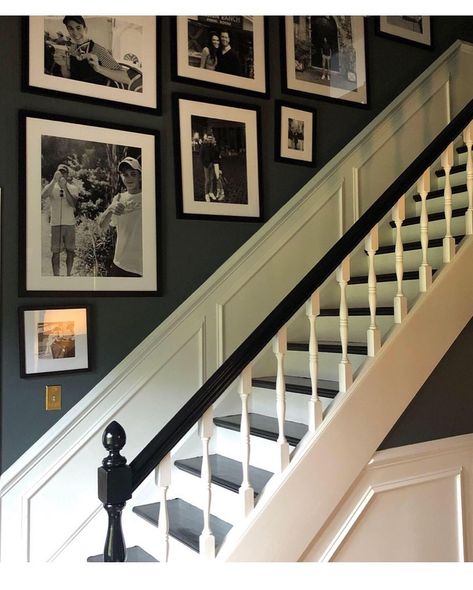 35 Gorgeous Black And White Stairs For A Classic Look White Landing And Stairs, Black Stairs Banister, Black And White Hand Railing, Traditional Staircase Ideas, Dark Blue Hallway And Stairs, Hallway Black And White Photos, Entrance Hall And Stairs Ideas, Dark Staircase Walls, 1920 Staircase