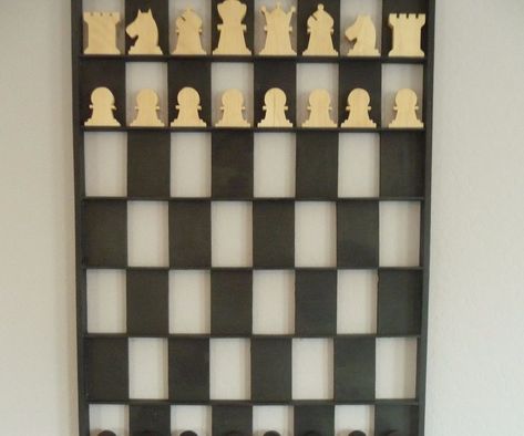 This is a design of a shadow boxthat can also be used as a vertical chess board. It is made using hand tools and it is a straightforward project for even the novice. Just a miter box saw, a hammer, some glue, nails, and you can easily build this in a Saturday afternoon. As a shadow box is has 64 suggested spaces but because there are no vertical inner walls, objects can occupy more than one space in a row. A larger shelf is on the bottom.As a vertical chess board it allows easy access to a v... Vertical Chess Board, Chess Pattern, Woodworking Plans Patterns, Large Chess Set, Useful Projects, Easy Weekend Projects, Wooden Board Games, Woodworking Plans Beginner, Interior Wall Paint