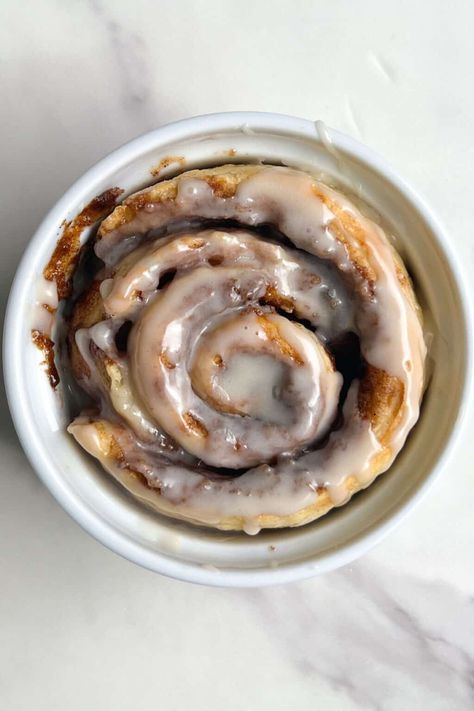 This Single Serve Cinnamon Roll is the perfect recipe for when the craving hits but you don't want to make a whole tray. It's easy to make, perfectly fluffy and delicious. Feasty Travels, Single Serve Cinnamon Roll, Single Serve Dessert Recipes, Cinnamon Roll Glaze, Ramekin Recipe, Moist Pumpkin Bread, Cinnamon Roll Dough, Single Serve Desserts, Single Serving Recipes