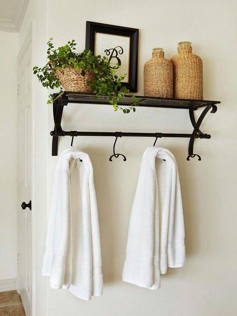 Don't settle for basic towel hooks sold in the bath department -- go beyond the standard options with a more decorative shelf-and-hook combo. Use this bathroom decorating idea to display accessories and toiletries above and hang towels and robes below. #BathroomStorage Space Bathroom, Decorative Shelving, Bathroom Decorating, Room Shelves, Towel Rack Bathroom, Small Bathrooms, Bathroom Redo, Stylish Bathroom, Bathroom Renos