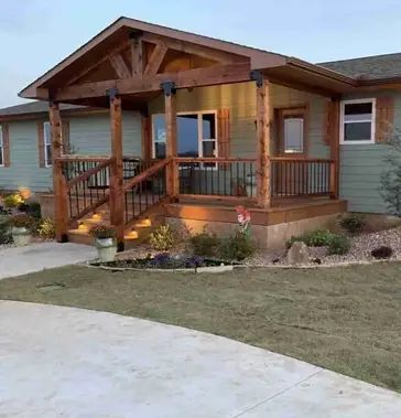 5 Easy Ways to Add Curb Appeal To Your Manufactured Home Curb Appeal For Manufactured Homes, Manufactured Home Back Patio Ideas, Porches For Manufactured Homes, Double Wide Curb Appeal, Mobile Home Makeovers Exterior, Front Porch Add On, Manufactured Farmhouse, Adding Front Porch To Ranch Style House, Paint Metal Siding