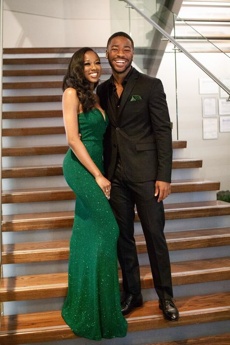 Green Dress And Black Suit Couple, Prom Guys Outfits Black, All Black Suit With Green Tie, Prom Outfits For Guys Green, Green Prom Dress Black Couple, Emerald Green Homecoming Couple, Green Prom Black Couple, Green And Black Prom Couple, Dark Green Hoco Couple