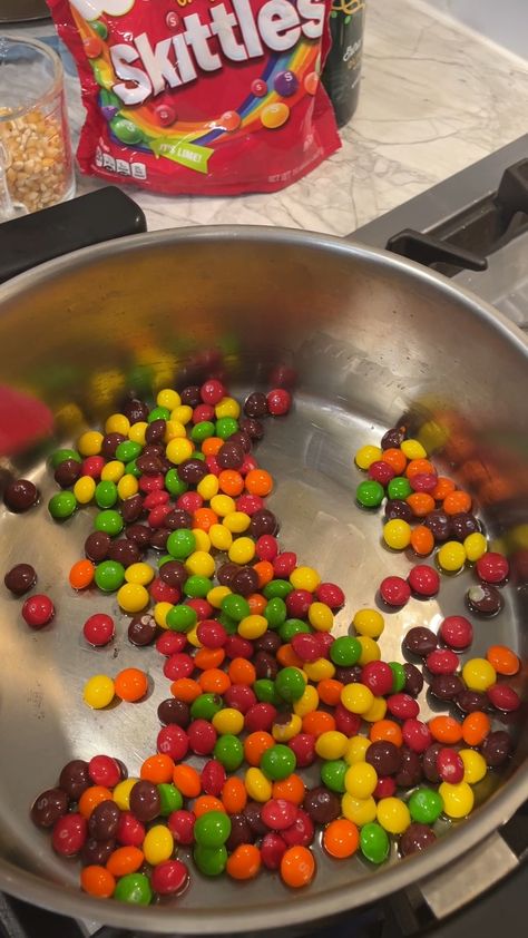 Make SKITTLE POPCORN in you own kitchen! Auntie Becca shows you the way... | Crunchy popcorn covered in the sweetness of Skittles candy. Great for creating individual holiday "popcorn-balls", as well! | By Steve J Skittle Popcorn, Skittles Popcorn Recipe, Colored Popcorn Recipe, Popcorn Video, Skittles Candy, Holiday Popcorn, Colored Popcorn, Making Candy, Popcorn Treats