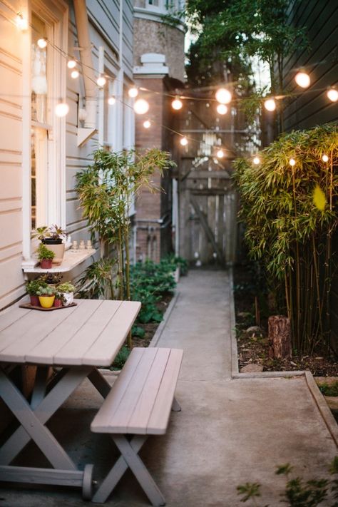 Backyard landscaping ideas cafe lights ; Gardenista Shed Inspiration, Cosy Garden, Design Per Patio, Herb Wall, Serene Garden, Side Yards, San Francisco Houses, Dry Creek, Small Outdoor Spaces