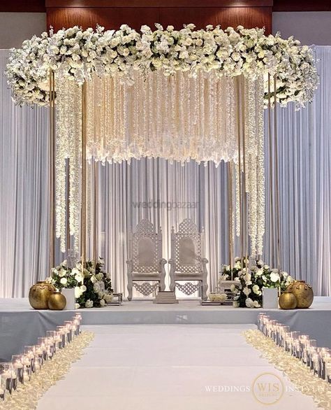 Incorporate The Serenity & Beauty Of White Flowers Into Your Wedding Decor | WeddingBazaar Thread Decor, Stage Decor Ideas, Wedding Stage Decoration Ideas, Stage Decoration Ideas, White Floral Decor, Indian Wedding Stage, Wedding Stage Backdrop, Janmashtami Decoration, Wedding Stage Decor