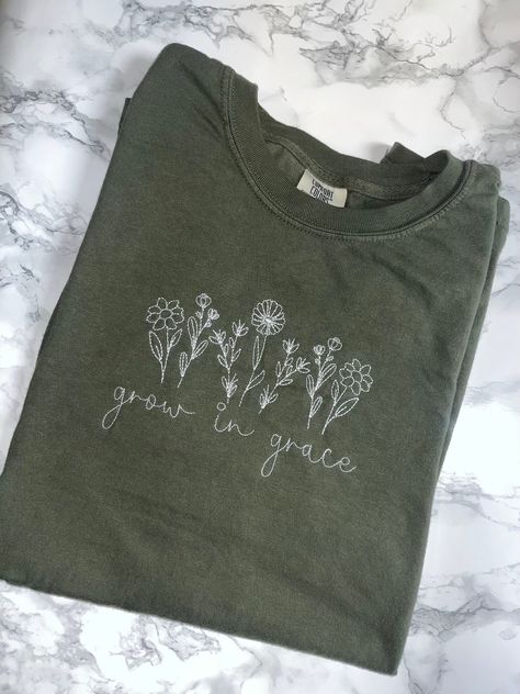 "Grow in Grace Comfort Colors Tee Wildflowers, Christian, Faith, Religious, Bible Verse Embroidered * This is a normal Unisex size Comfort Colors T- Shirt. * For an oversized tee, please size up 1 size based off your measurements on the size chart provided. * If you are wanting an oversized \"Sleep shirt/Dress shirt\" look, we recommend sizing up 2 sizes. * Please review the size chart to ensure you receive the fit you want. Colors: See Drop down Menu and Photos Material: 100% Garment-dyed soft Embroidered Bible Verse Shirt, Bible Verse T Shirts, Christian Embroidery Designs Shirt, Embroidery Shirt Designs, Christian Embroidery Designs, Bible Verse Embroidery, Bible Verse Shirts, Christian Embroidery, Christian Shirts Designs