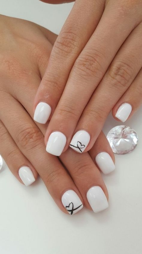 White Nails With Designs Valentines, White Nails With Valentine Design, Pretty Short Nails Simple White, Shellac Nails White Design, Gel White Nail Designs, White Nails For Valentines Day, White Nails With Designs Gel, White Nails With Black Heart Art Designs, White Nails Inspiration Short