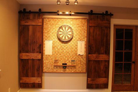 Wine cork dartboard - hidden with barn doors Hidden Dart Board Ideas, Man Cave Table, Cork Dartboard, Dart Board Wall, Simple Home Decor, Decor Hacks, Basement House, Pool Rooms, Home Decor Hacks